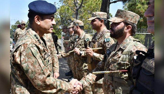Chief of Army Staff General Asim Munir meets officers and troops on the forward positions along the Line of Control on April 6. — ISPR