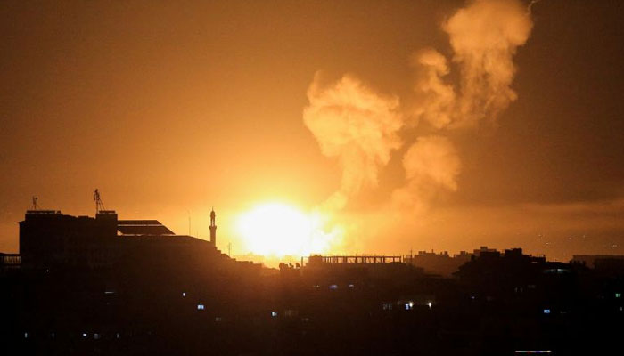 Flames can be seen during Israeli airstrikes in Gaza on April 6, 2023. Reuters.