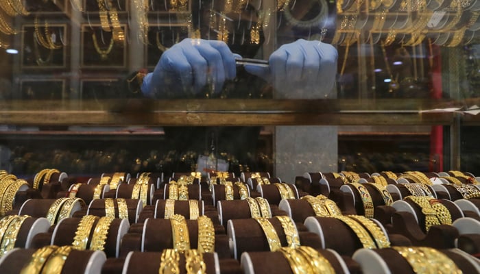 Seller waits for customers at a jewellery showroom. — Reuters/File