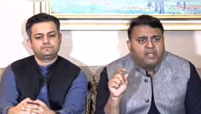 PTI leaders Hammad Azhar (L) and Fawad Chahudry (R) speak during a presser in Lahore on April 8, 2023. — Twitter/PTIofficial