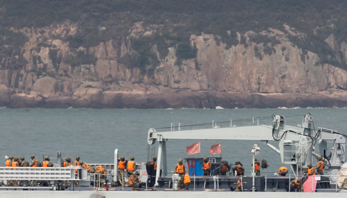 Soldiers stand on the deck of a Chinese warship as it sails during a military drill near Fuzhou, Fujian Province, near the Taiwan-controlled Matsu Islands that are close to the Chinese coast, China, April 8, 2023. — Reuters