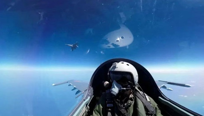 A pilot is photographed operating an aircraft of the Air Force under the Eastern Theatre Command of Chinas Peoples Liberation Army (PLA) during a combat readiness patrol and Joint Sword exercises around Taiwan, at an undisclosed location in this handout image released on April 8, 2023. — Reuters