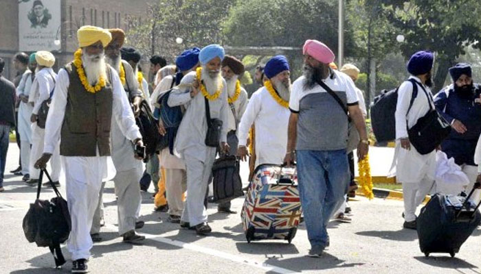 Sikh Yatrees arrives at Wagah Border to celebrate Vesakhi festival, on April 9, 2023. — APP