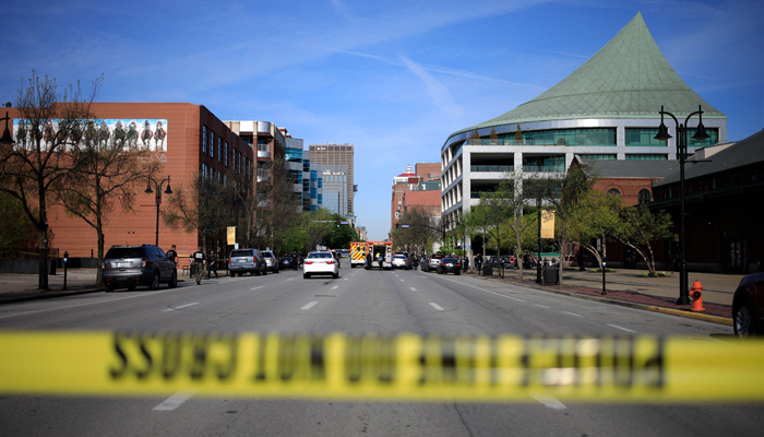 Crime scene tape cordons off a street as law enforcement officers respond to an active shooter near the Old National Bank building on April 10, 2023, in Louisville, Kentucky. — AFP