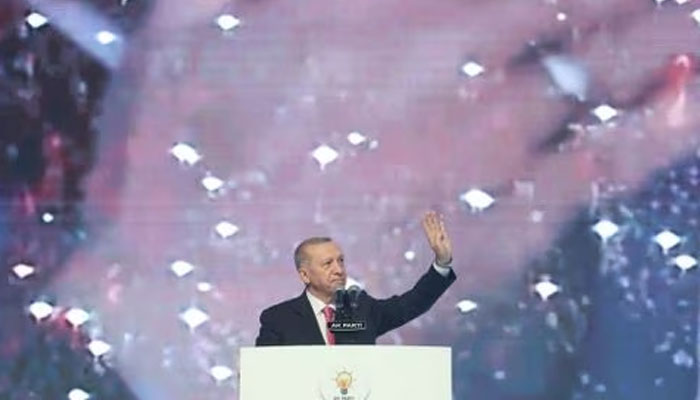 Turkish President Tayyip Erdogan greets the audience during a meeting of his ruling AK Party to announce the partys election manifesto ahead of the May 14 elections, in Ankara, Turkey April 11, 2023.—Reuters