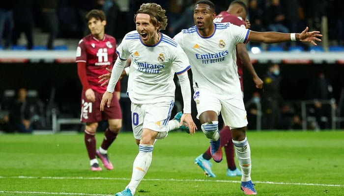 Real Madrids Luka Modric celebrates scoring their second goal with David Alaba during aReal Madrid v Real Sociedad match in Madrid, Spain on March 5, 2022. — Reuters