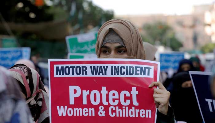 A supporter of religious and political party Jamaat-e-Islami (JI) carries a sign against a gangrape during a demonstration in Karachi, September 11, 2020. — Reuters
