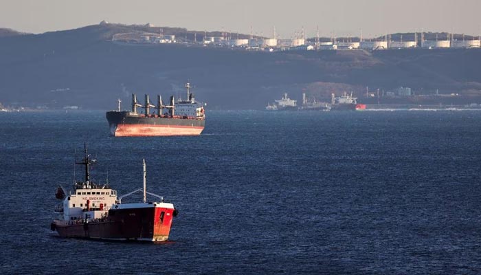The oil products tanker Nord and a bulk carrier sail near the crude oil terminal Kozmino in Nakhodka Bay near the port city of Nakhodka, Russia, December 4, 2022.