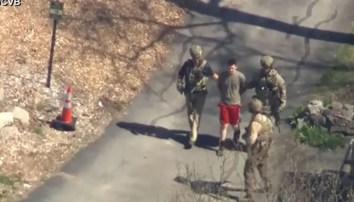 Still image taken from video shows FBI agents arresting Jack Teixeira outside a residence in North Dighton, Massachusetts [WCVB-TV via ABC via Reuters]