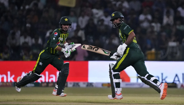 Saim Ayub (left) and Fakhar Zaman run between the wickets during Pak vz NZ match in Lahore, on April 14, 2023. — Twitter/PCB
