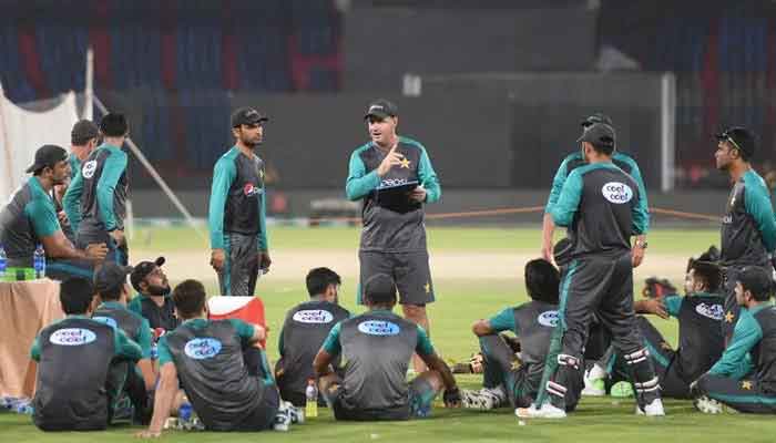 Mickey Arthur speaks to his team in Karachi on March 29, 2018. — AFP