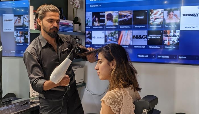 A customer is getting her hair done at the newly-opened branch of Tony&Guy. — Photo by Author