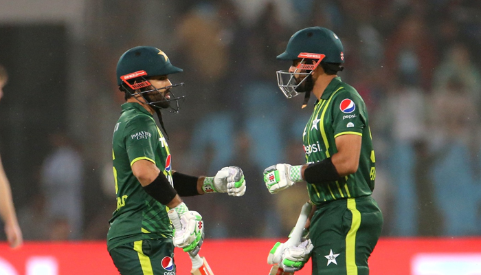 Pakistans opening pair Babar Azam (right) and Mohammad Rizwan bump fists during a match against New Zealand in Lahore, on April 15, 2023. — Twitter/TheRealPCB