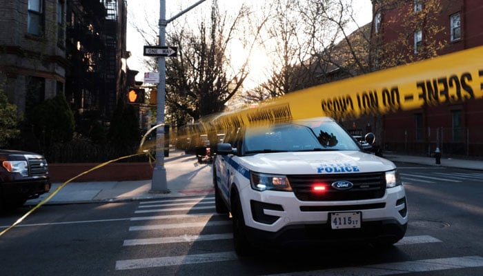 A police vehicle can be seen standing in this picture while responding to a shooting incident — AFP/File