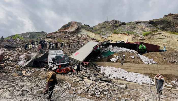 A view of trucks loaded with supplies are seen trapped in a landslide on the road close to the Torkham border, Pakistan April 18, 2023. —Reuters