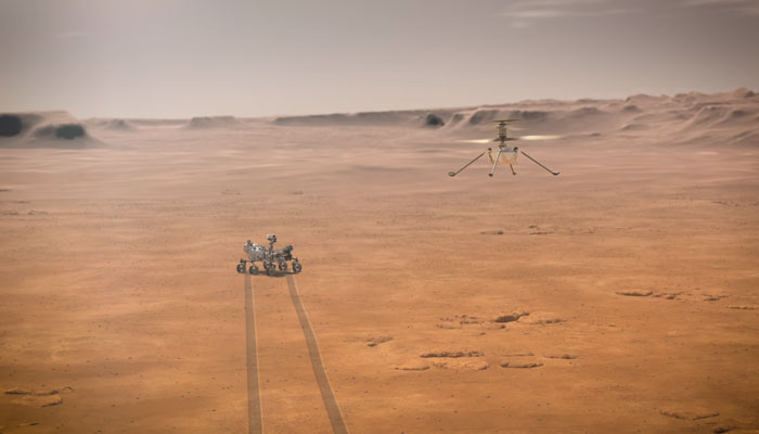 In the air, Nasas Ingenuity helicopter can be seen on right and Nasas Perseverance rover can be seen on the ground in this screengrab taken on April 18, 2023. — YouTube/Nasa Jet Propulsion Laboratory