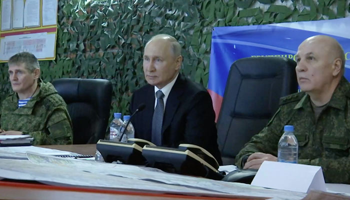 President Vladimir Putin (centre) while visiting the Headquarters of the Dnepr Group of Forces in the Kherson sector in this picture released on April 18, 2023. — Kremlin