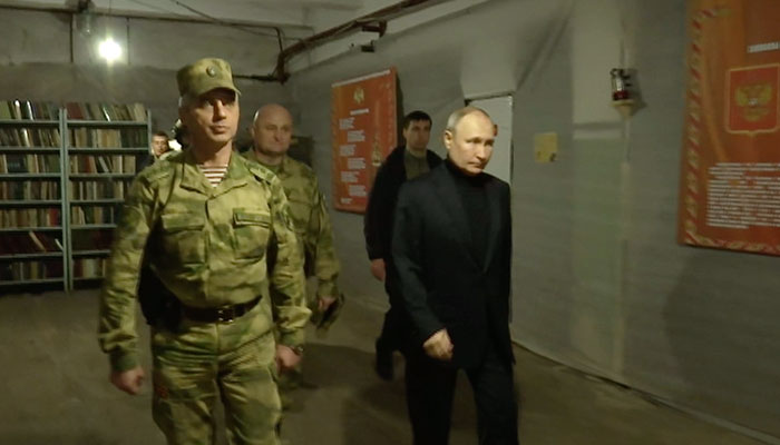 President Vladimir Putin (right) while visiting the Headquarters of the Dnepr Group of Forces in the Kherson sector in this picture released on April 18, 2023. — Kremlin