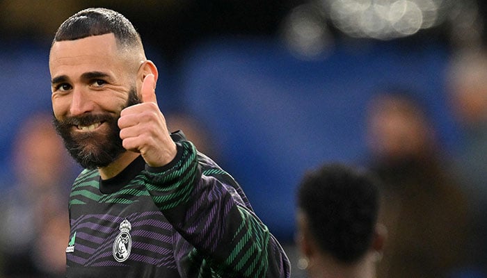 Real Madrids French striker Karim Benzema warms up ahead of the Champions League quarter-final second-leg football match between Chelsea and Real Madrid at Stamford Bridge in London on April 18, 2023. AFP