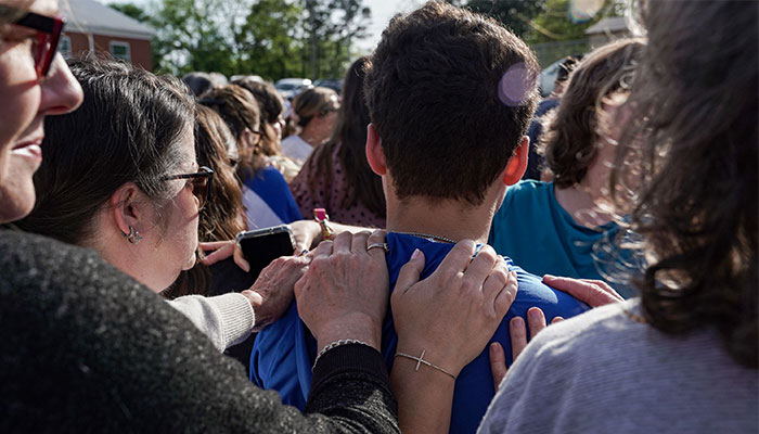 DADEVILLE, AL - APRIL 16: Mourners attend a vigil at the First Baptist Church of Dadeville following last night´s mass shooting at the Mahogany Masterpiece dance studio on April 16, 2023, in Dadeville, Alabama.—AFP