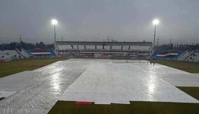 A general view of a stadium ground covered with sheets to prevent damage from rain. — AFP/File
