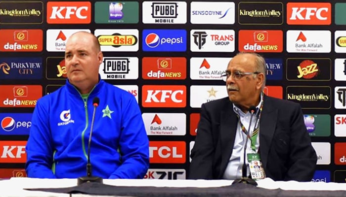 Director of the Pakistan men’s cricket team Mickey Arthur (left) addresses a press conference in Islamabad, on April 20, 2023. — PCB