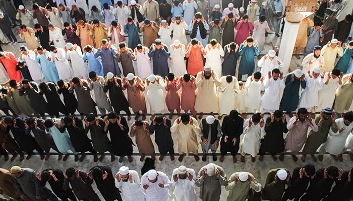 Believers during Eid ul Fitr prayers at Masjid-e-Khizra in Karachis Saddar area, on April 22, 2023. — Hassaan Ahmed