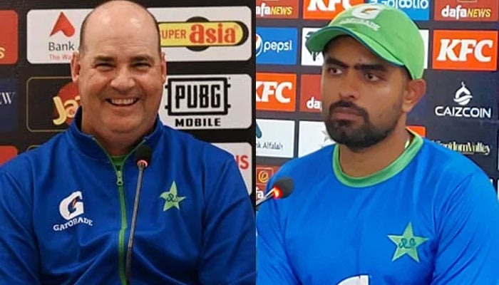 Pakistan cricket team’s director Mickey Arthur (L) and skipper Babar Azam (R). —AFP/PCB/File