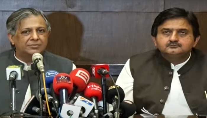 Law Minister Azam Nazeer Tarar (left) and PML-N leader Malik Ahmad Khan speak during a presser in Islamabad on April 25, 2023, in this still take from a video. — YouTube/PTV News Live