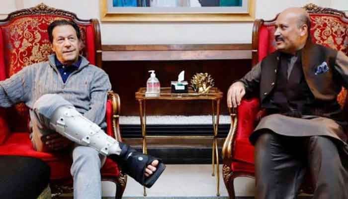 Pakistan Tehreek-e-Insaf (PTI) Chairman Imran Khan (left) with security in-charge Iftikhar Rasool Ghumman. — Facebook/Ch Iftikhar Rasul Ghumman Pti Official