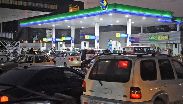 A view of carowners standing in a queue for filling petrol outside a petrol pump in this undated picture. — Online