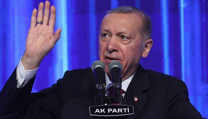 Turkish President and Leader of the Justice and Development (AK) Party, Recep Tayyip Erdogan, addresses the crowd at Ankara Sports Hall during the unveiling of the AK Partys Election Manifesto in Ankara, Turkey on April 11, 2023. — AFP