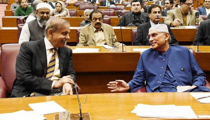 Prime Minister Shehbaz Sharif (left) speaks to PPP Co-chairman Asif Ali Zardari during a National Assembly session, on April 27, 2023. — Twitter/@NAofPakistan