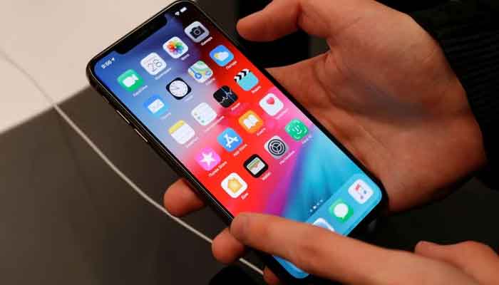 A customer tests a smartphone during the launch of the new iPhone XS and XS Max sales at re:Store Apple reseller shop in Moscow, Russia September 28, 2018. — Reuters