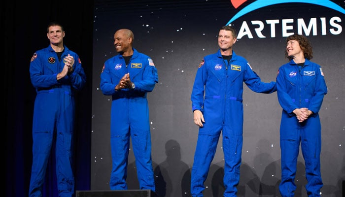 (L-R) Astronauts Jeremy Hansen, Victor Glover, Reid Wiseman and Christina Hammock Koch celebrate after being selected for the Artemis II mission who will venture around the Moon during a news conference held by NASA and CSA at Nasa Johnson Space Centers Ellington Field in Houston, Texas, on April 3, 2023. — AFP