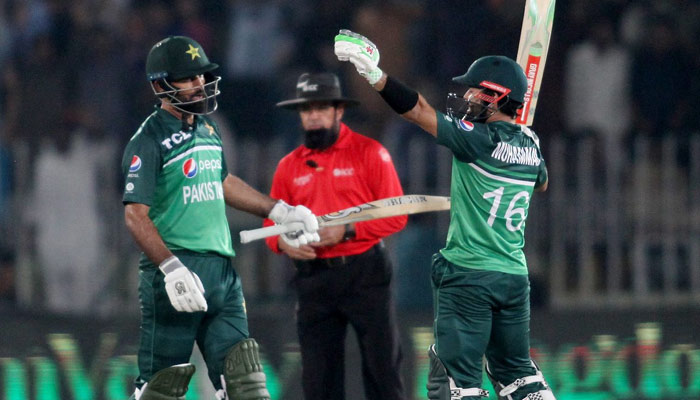 Pakistans Fakhar Zaman (left) and Mohammad Rizwan (right) during the second one-day international (ODI) cricket match between Pakistan and New Zealand at the Rawalpindi Cricket Stadium in Rawalpindi on April 29, 2023. — AFP