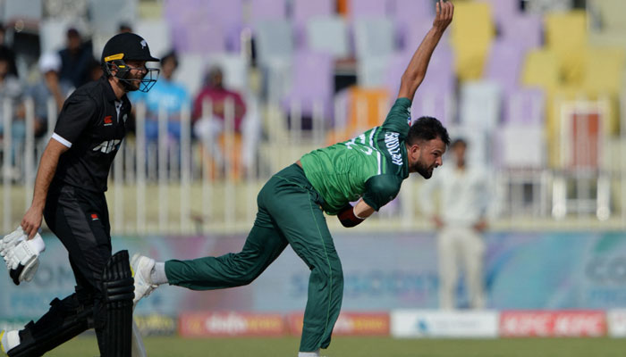 Ihsanullah (R) bowls during the second one-day international (ODI) cricket match between Pakistan and New Zealand at the Rawalpindi Cricket Stadium in Rawalpindi on April 29, 2023. — AFP