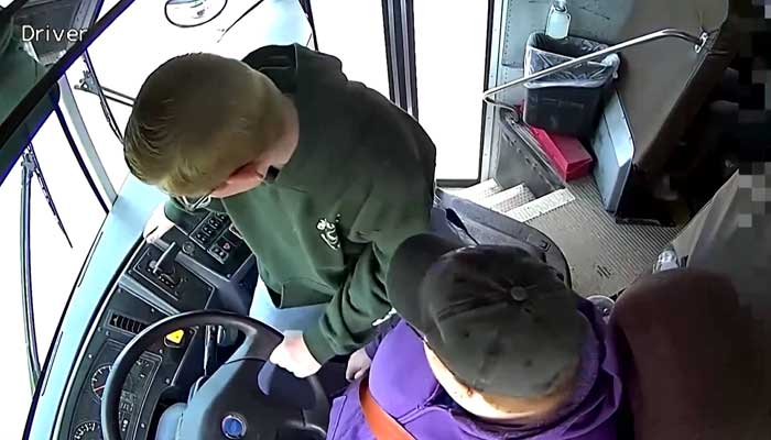 Theseventh-grader is seen steer the school bus while the driver remains unconscious, in this still taken from a video released on April 29, 2023. — Twitter/BBCWorld