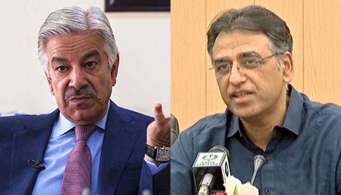 Khawaja Asif (left) and Asad Umar. — AFP/File/GeoNews/YouTube/Screengrab