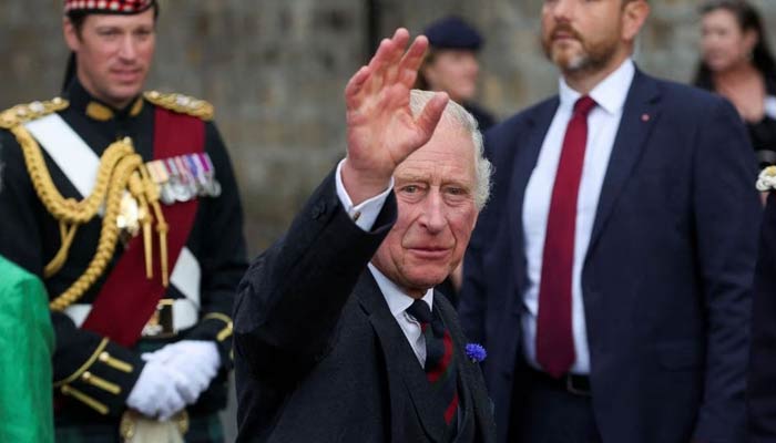 Britains King Charles waves at an official ceremony in Scotland on October 3, 2022. — Reuters