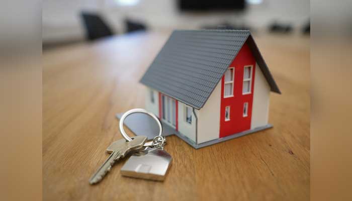 A representational model of house with keys kept on the side. — Pixabay