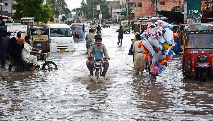 In this undated photo, a road is seen submerged under rainwater. — APP/File