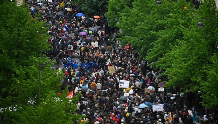 Demonstrators take part in a demonstration on Labour Day, to mark the global day of the workers. — AFP