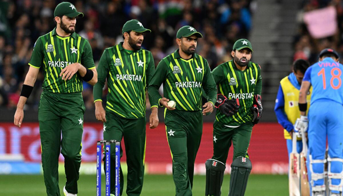 Pakistans players walk back to their fielding positions during the ICC Mens T20 World Cup 2022 match between India and Pakistan at Melbourne Cricket Ground. — AFP/File