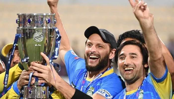 Former Pakistan skipper Shahid Afridi poses with LLC cup after winning final on March 20, 2023. — LLC