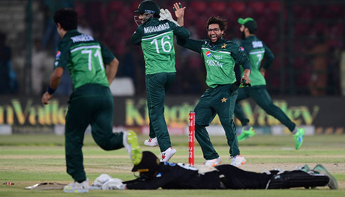 Pakistans cricketers celebrate after runout of New Zealands Tom Blundell (in black jersey) during the third ODI between Pakistan and New Zealand at the National Stadium in Karachi on May 3, 2023. — AFP