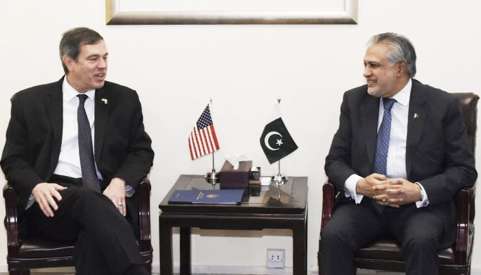 Finance Minister Senator Ishaq Dar (right) meets US Embassy Charge’d Affaires Andrew Schofer in Islamabad, on May 3, 2023. — Twitter/@FinMinistryPak