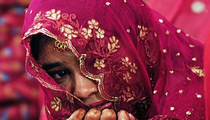 A bride in a mass wedding ceremony in Karachi. — AFP/File