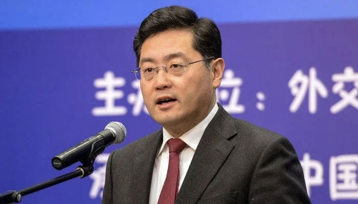 Chinas new foreign minister Qin Gang speaks at an event in Beijing on December 25, 2013 — AFP