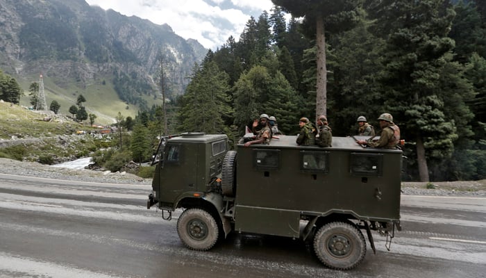 Indian army soldiers are seen atop a vehicle. — Reuters/File